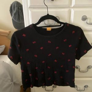 A black tee with red dragons designed
